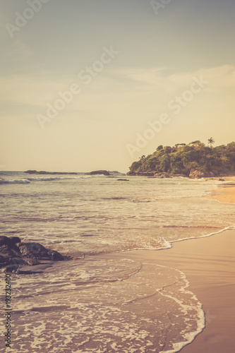 Tropical beach. Beautiful landscape of Indian ocean, Sri Lanka. Toning photo