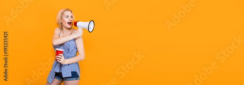 Blonde woman in blue striped blouse with megaphone