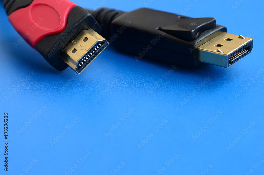 Audio video HDMI computer cable plug and 20-pin male DisplayPort gold  plated connector for a flawless connection on a blue background Stock Photo  | Adobe Stock