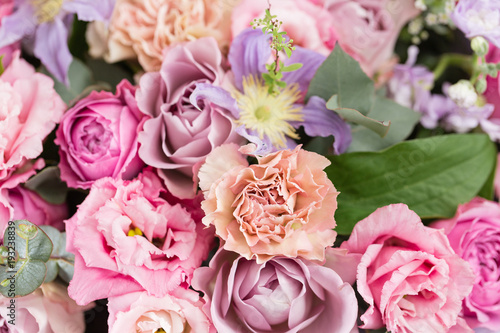 Close-up beautiful luxury bouquet of mixed flowers in glass vases. the work of the florist at a flower shop. Wallpaper