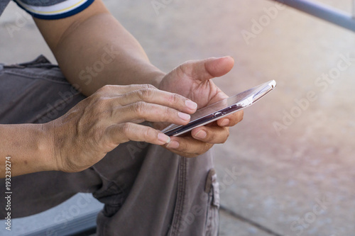 Man using mobile phone in the street.  with copy space for text.