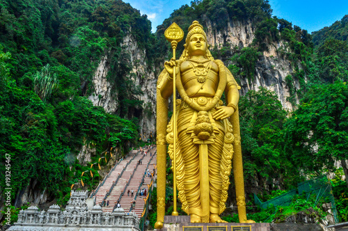 Lord Murugan Statue - Batu Caves is a limestone hill that has a series of caves and cave temples in Gombak  Selangor  Malaysia. It takes its name from the Sungai Batu  which flows past the hill.