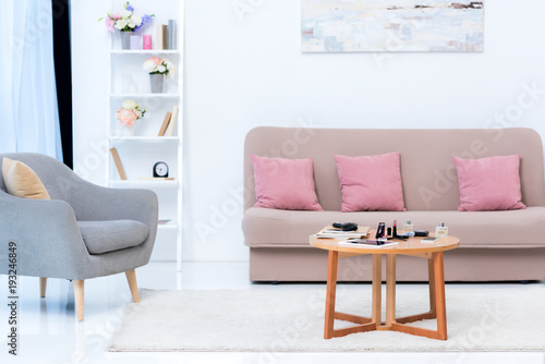 cozy stylish interior and various cosmetics on table