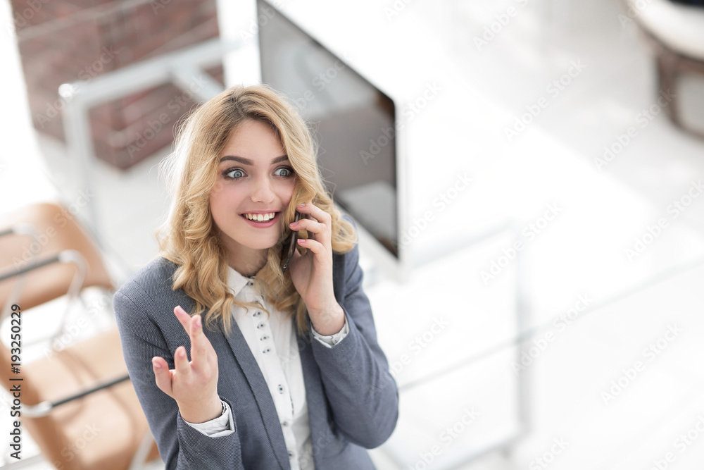happy employee is talking on the smartphone happy employee is talking on the smartphone