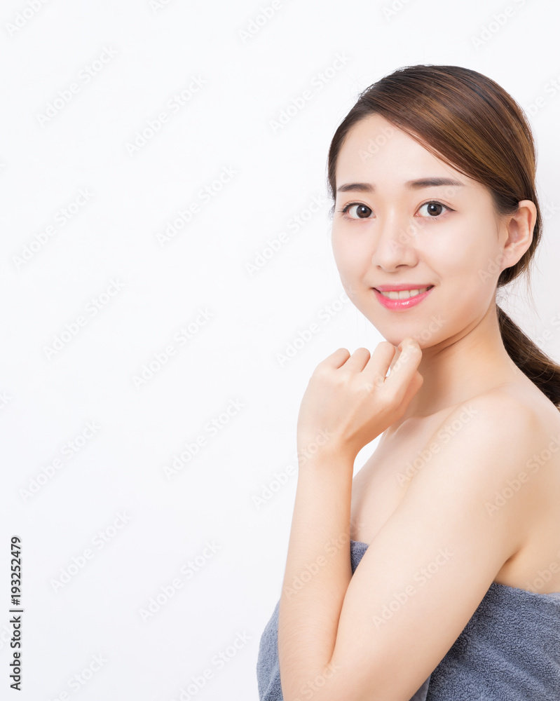 Young smiling woman with beautiful face, clean healthy skin. Body care concept. Young smiling woman with beautiful face, clean healthy skin. Body care concept.