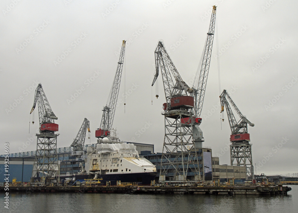 Harbor cranes in sea cargo port in Helsinki Harbor cranes in sea cargo port in Helsinki