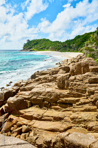 beautiful paradise beach anse bazarca. white sand,turquoise water,palm trees, granite rocks, seychelles