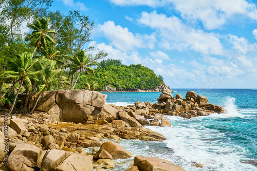 beautiful paradise beach anse bazarca. white sand,turquoise water,palm trees, granite rocks, seychelles © LR Photographies