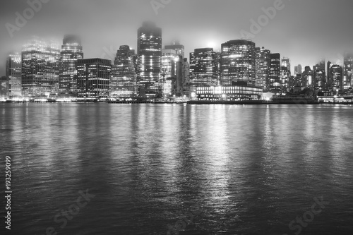 Manhattan at a foggy night  New York City  USA