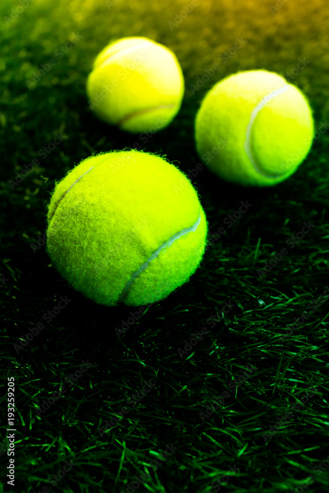 Tennis ball on artificial grass