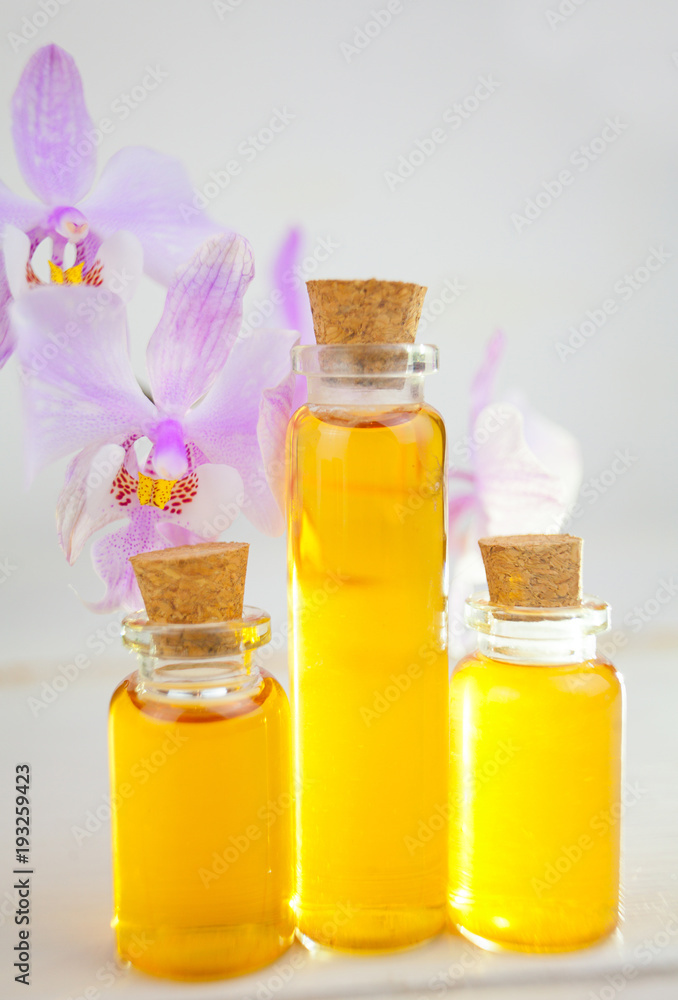 Essence of flowers on table in beautiful glass Bottle Essence of flowers on table in beautiful glass Bottle
