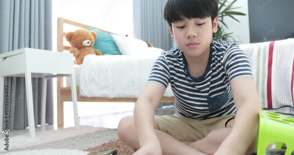 Asian cute boy doing your hose housework, housekeeping, and household concept. Asian cute boy doing your hose housework, housekeeping, and household concept.