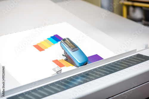 Spectrometer tool on the printing at the operating table of the printing plant photo