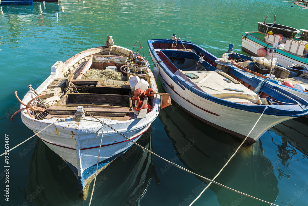 Fishing port with old wooden fishing boats in Sicily, Italy