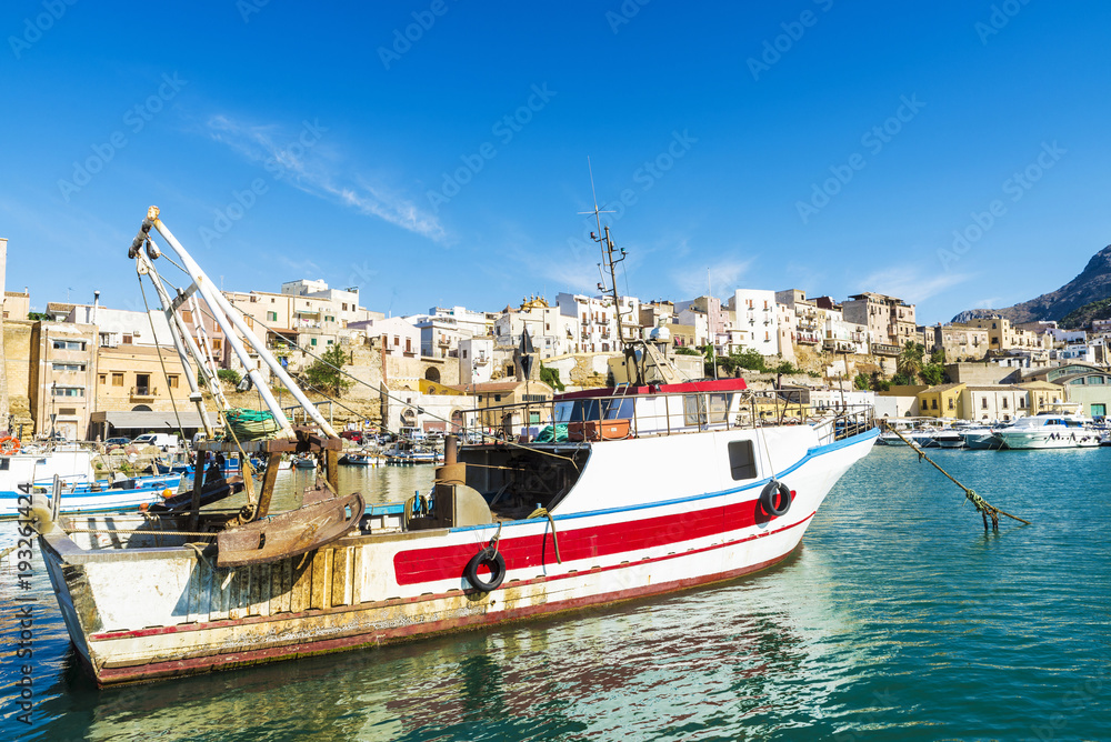 Fishing port with old wooden fishing boats in Sicily, Italy