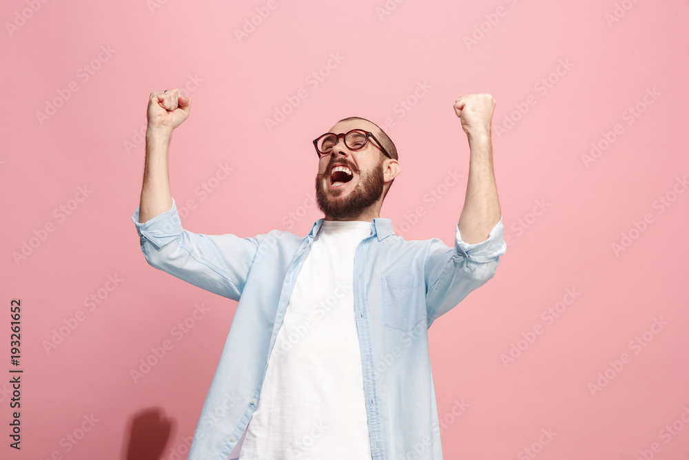 Winning success man happy ecstatic celebrating being a winner. Dynamic energetic image of male model Winning success man happy ecstatic celebrating being a winner. Dynamic energetic image of male model