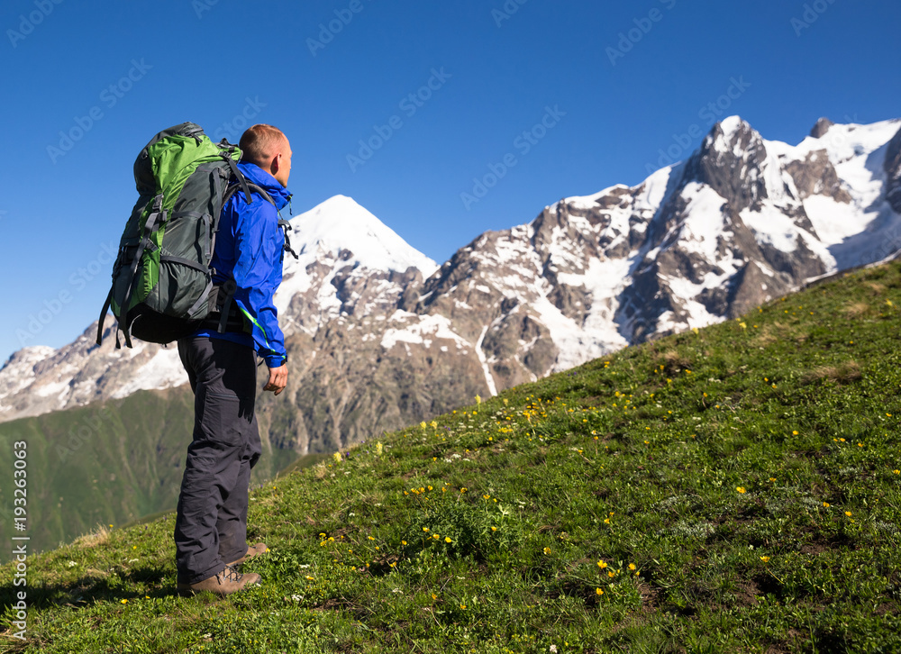 Happy hiker relax on beautiful mountains landscape