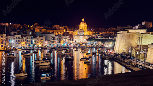 Night panoramic view of the city Kalkara and St.Joseph Church, city that is included in the landmarks of Malta
