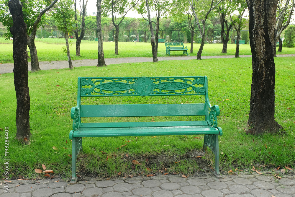 empty green chair in the public park
