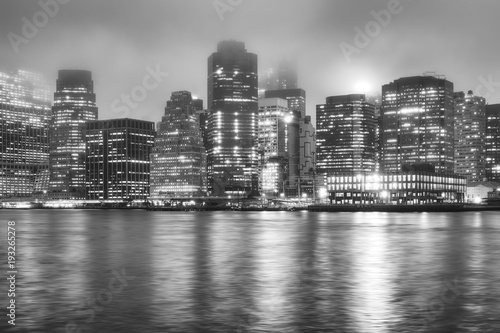Black and white picture of the Manhattan on a foggy night  New York City  USA.