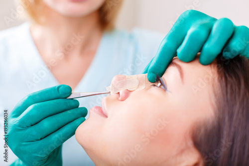 Doctor checking woman s face  the eyelid before plastic surgery  blepharoplasty.