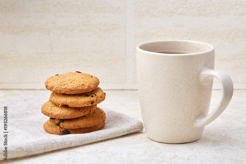Close-up white cup of coffee with chocolate chip cookies on white background, top view Close-up white cup of coffee with chocolate chip cookies on white background, top view
