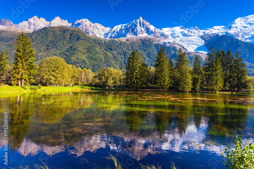  The lake reflected snow-capped Alps photo