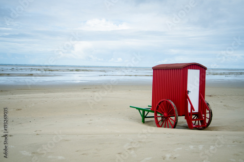 Fototapeta Naklejka Na Ścianę i Meble -  desrted seaside with a red bathing machine