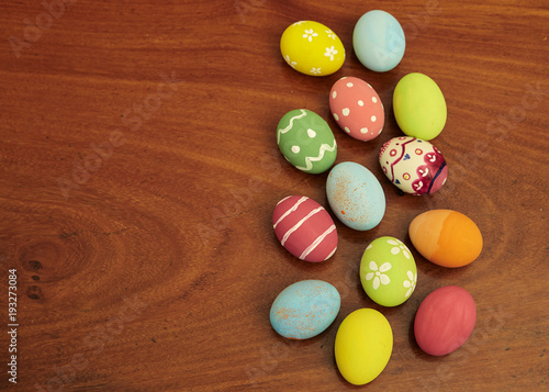 happy easter eggs on wooden