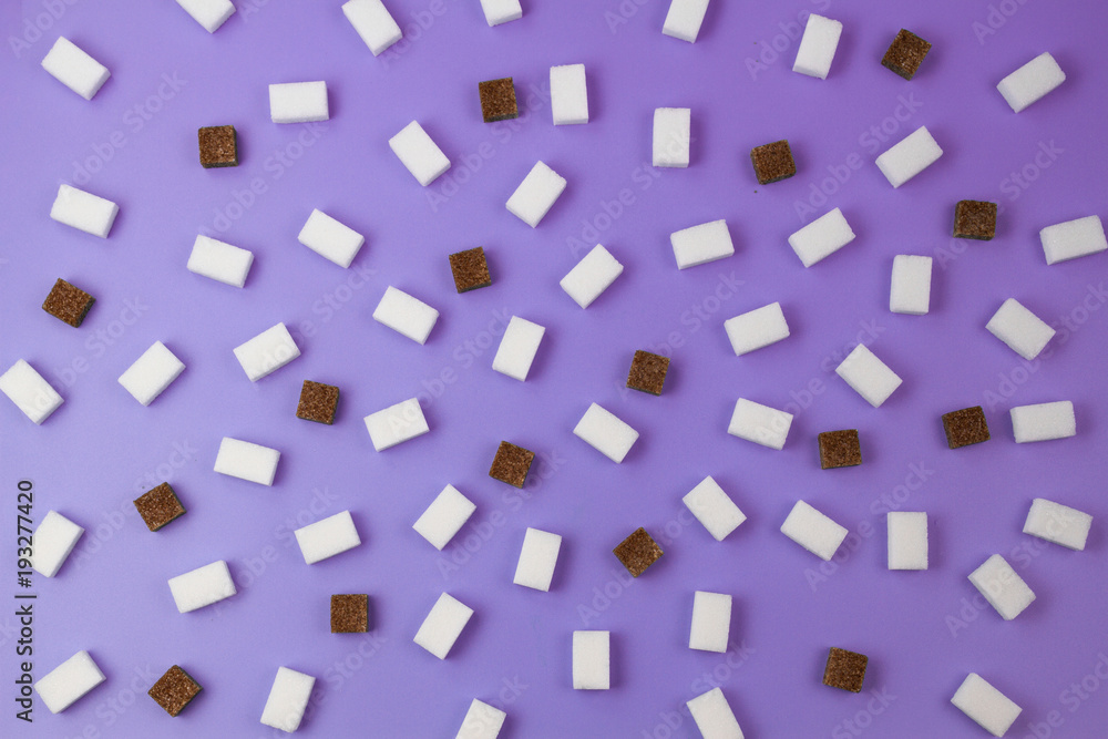 Brown and white sugar cubes pattern on violet background.