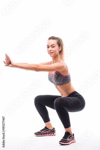 sport fitness woman, young healthy girl doing squat exercises, full length portrait over white background © F8  \ Suport Ukraine