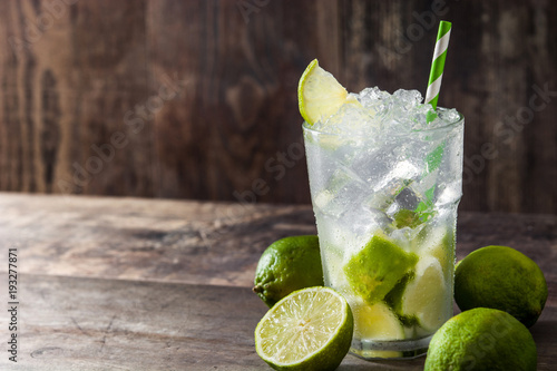 Wallpaper Mural Caipirinha cocktail in glass on wooden table background. Copyspace Torontodigital.ca