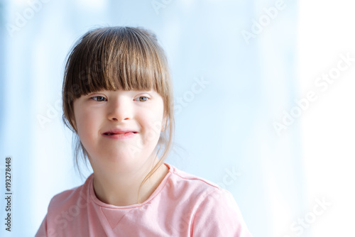 Portrait of cute kid with down syndrome