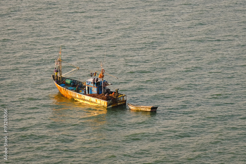 Indian fishermen boatt photo