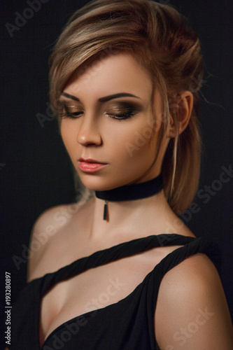 Close-up portrait of brunette woman with paper choker