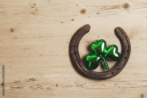 Lucky horse shoe with St Patrick's day green clover decorations