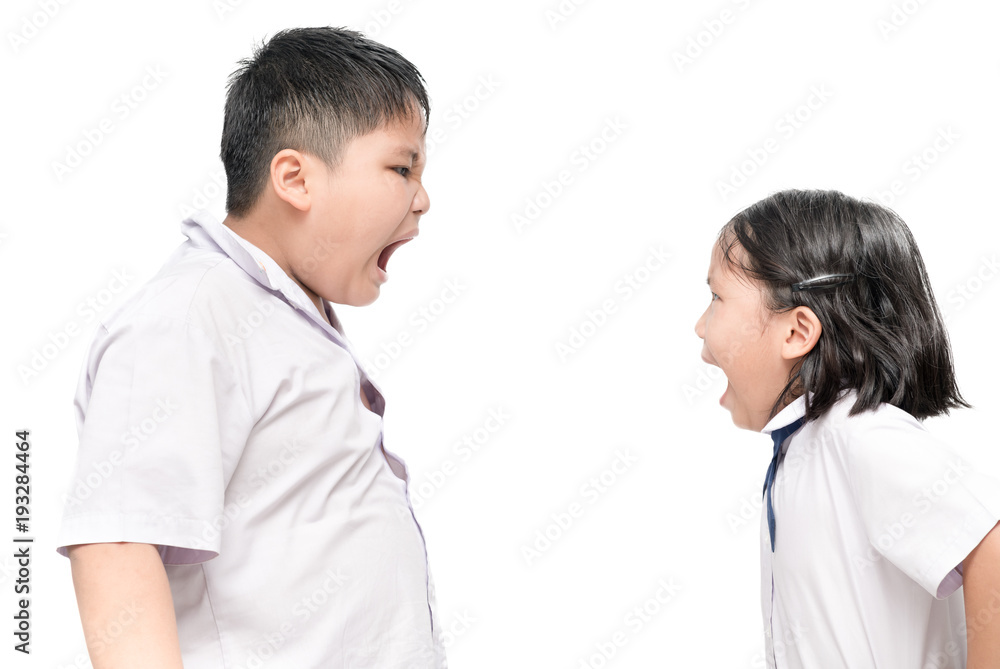 Brother and sister shouting to each other, isolated Brother and sister shouting to each other, isolated