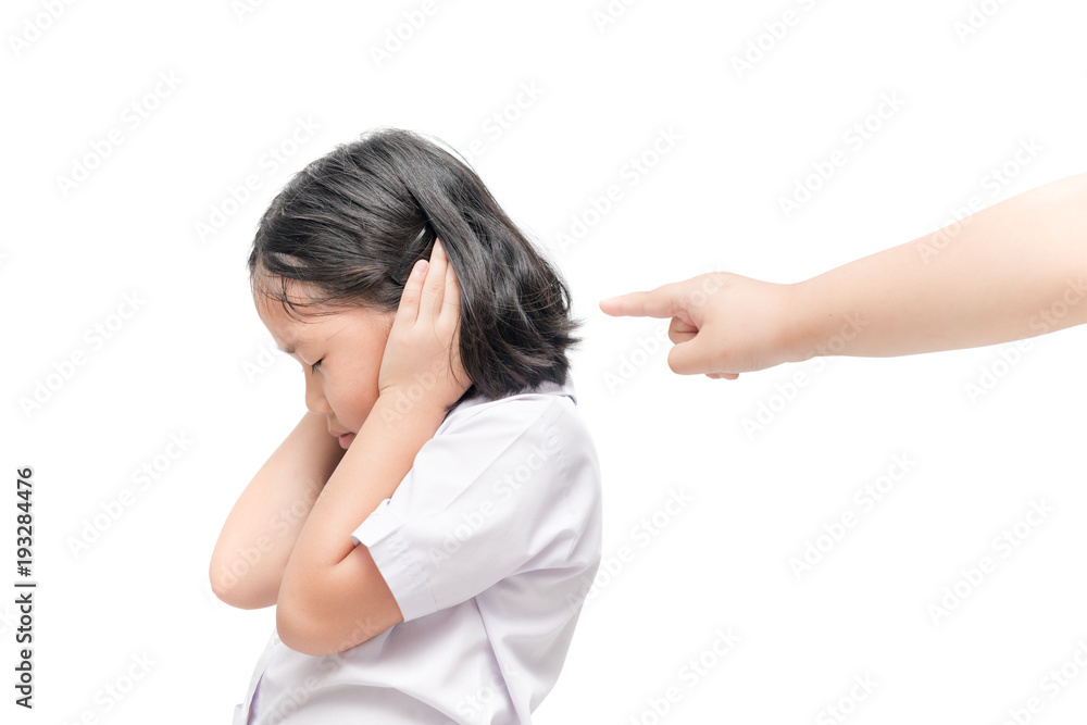Stressed girl closing ears with hands with hand pointing Stressed girl closing ears with hands with hand pointing