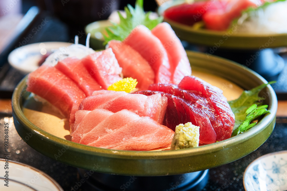 Close up shot of Fresh salmon, tuna, toro, maguro, otoro sashimi with wasabi on ceramic plate - obrazy, fototapety, plakaty 