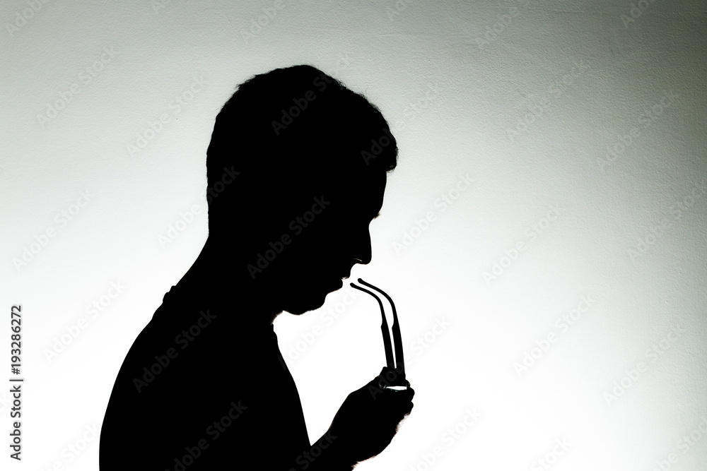 Man in backlight with glasses on a white background
Man in backlight with glasses on a white background