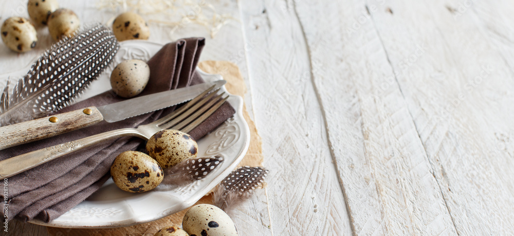 Easter table setting with quail eggs Easter table setting with quail eggs