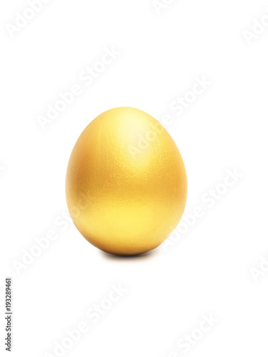 Golden egg isolated on white background with natural shadow