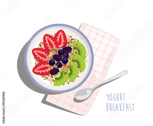 Yogurt Breakfast Bowl - Yogurt, fresh fruit and berries nicely arranged in a bowl with granola, chia seeds and goji berry. Easy and healthy morning meal with napkin and spoon.