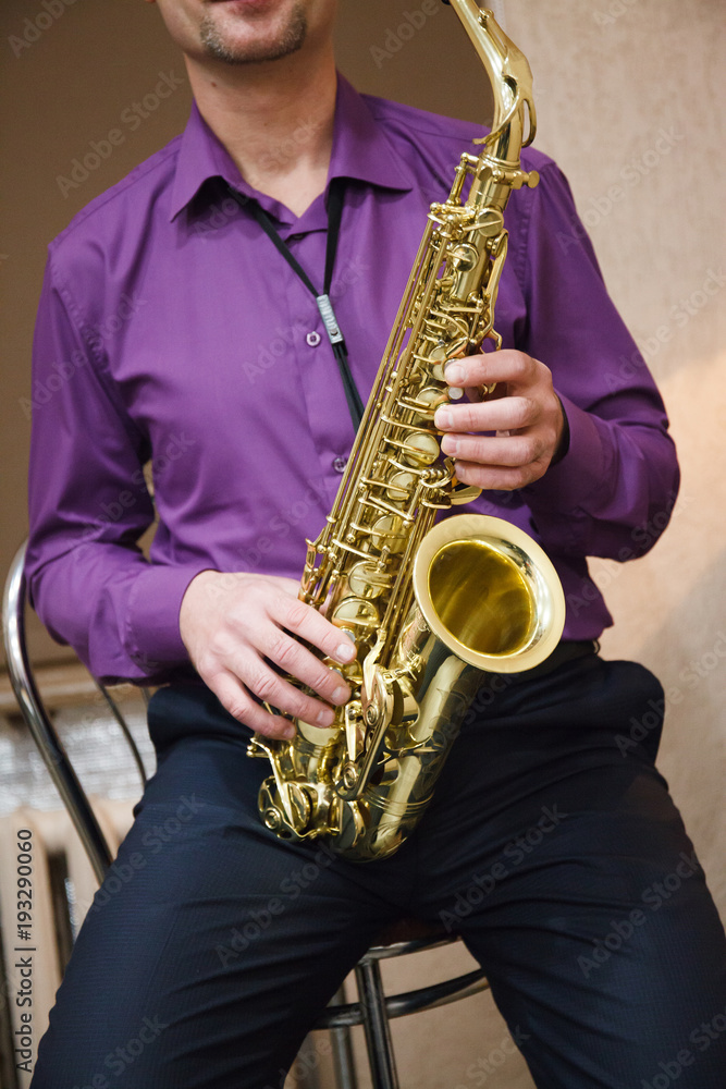Fototapeta premium Man playing on saxophone