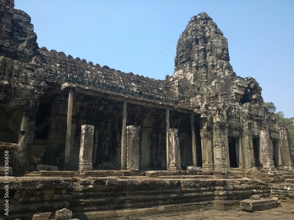 Angkor Wat in Siem Reap, Cambodia. Ancient ruins of Bayon Khmer stone temple in jungle forest.