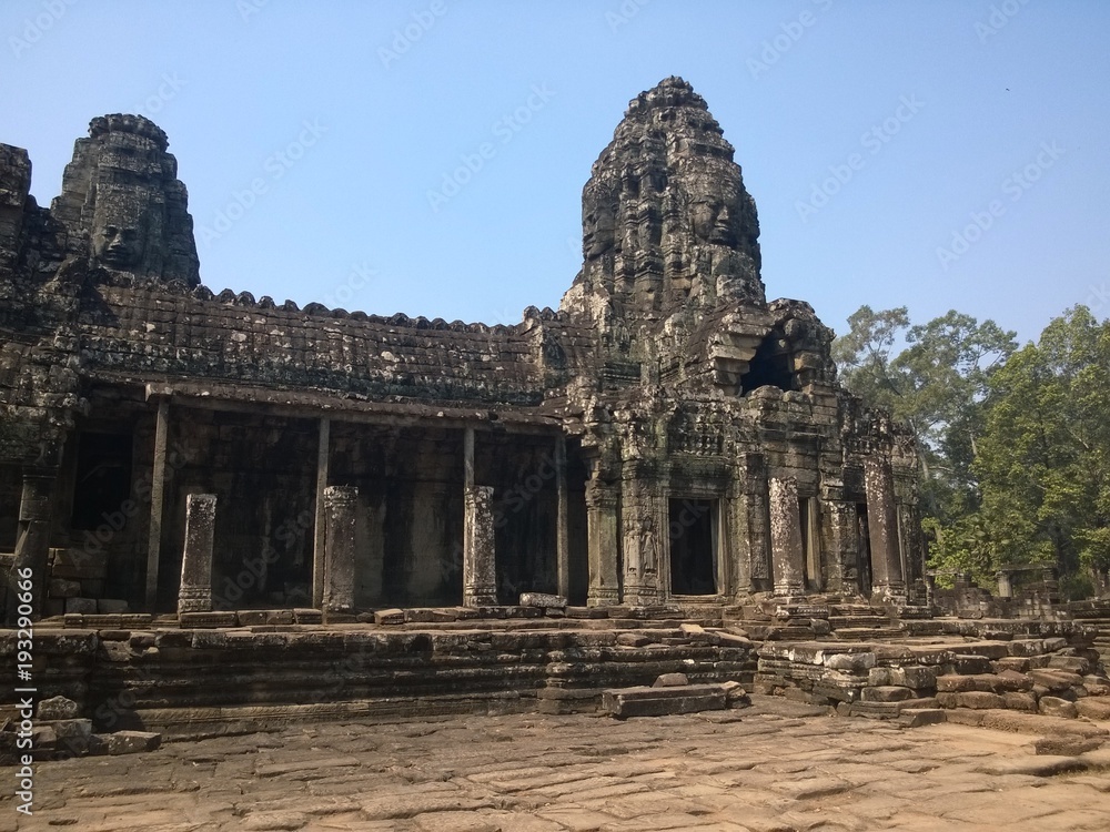 Angkor Wat in Siem Reap, Cambodia. Ancient ruins of Bayon Khmer stone temple in jungle forest.