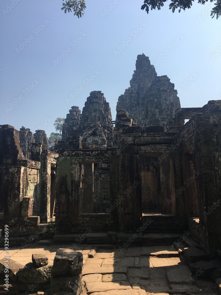 Fototapeta premium Angkor Wat in Siem Reap, Cambodia. Ancient ruins of Bayon Khmer stone temple in jungle forest.