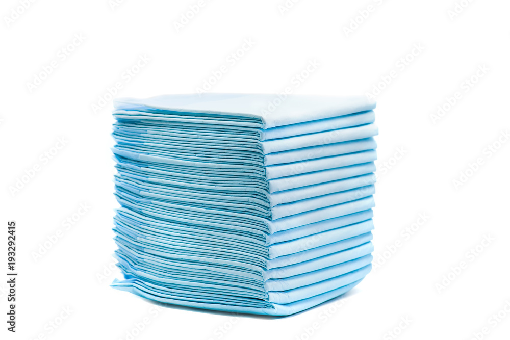 pile of toilet diapers for pets isolated on white. home absorbing towels for animals pile of toilet diapers for pets isolated on white. home absorbing towels for animals