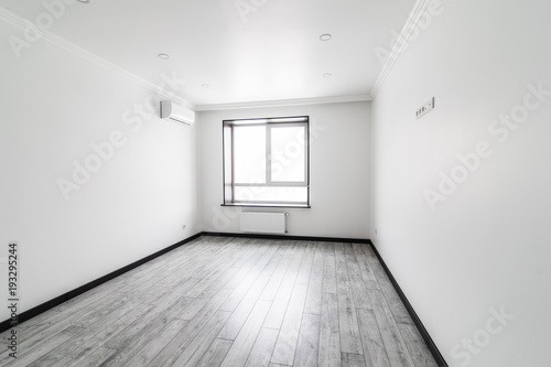 beautiful apartment  interior  big empty room with grey floor and bright window. New home. Rent hause. Sale appartment