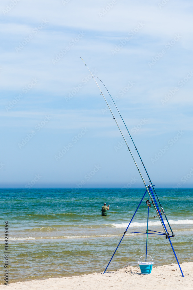 Fishing rod left alone on sea shore
